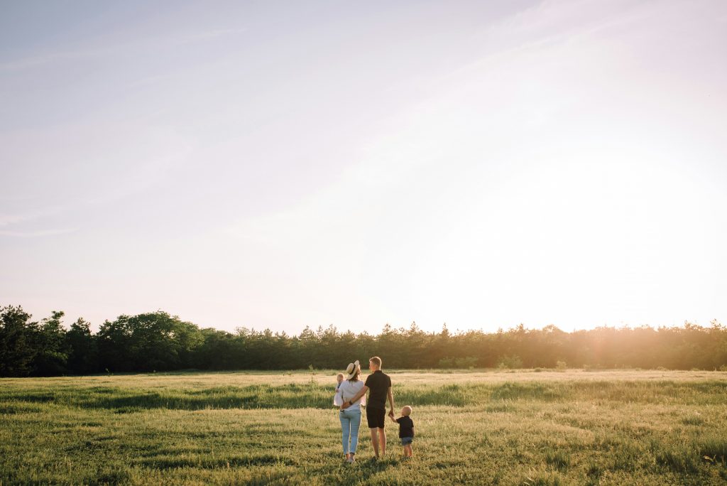 a group of people standing in a field
