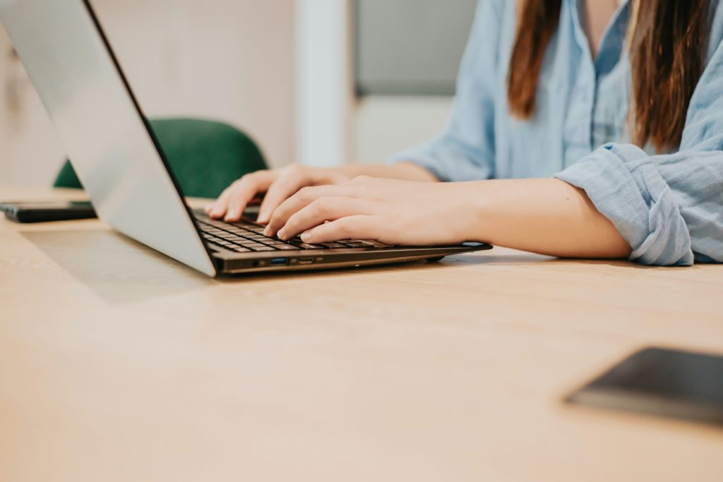 a person typing on a laptop
