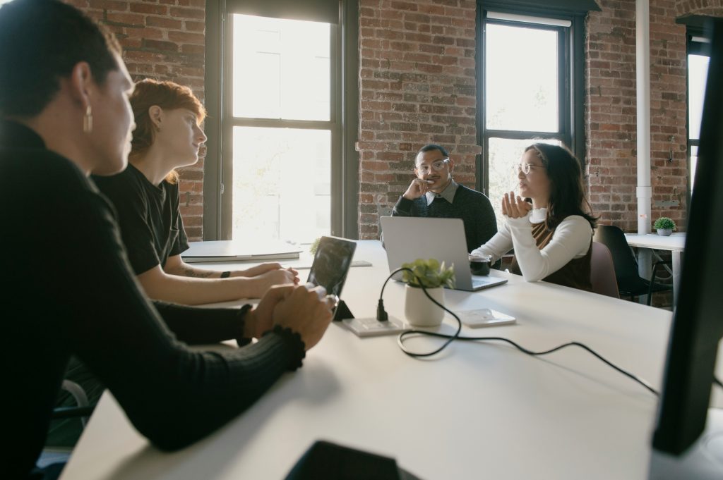 a group of people sitting around a table