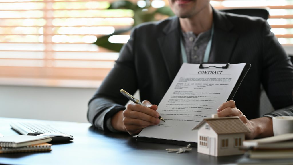 Can You Be Deported with a Work Permit? What Every Worker Must Know 16 a man signing a contract