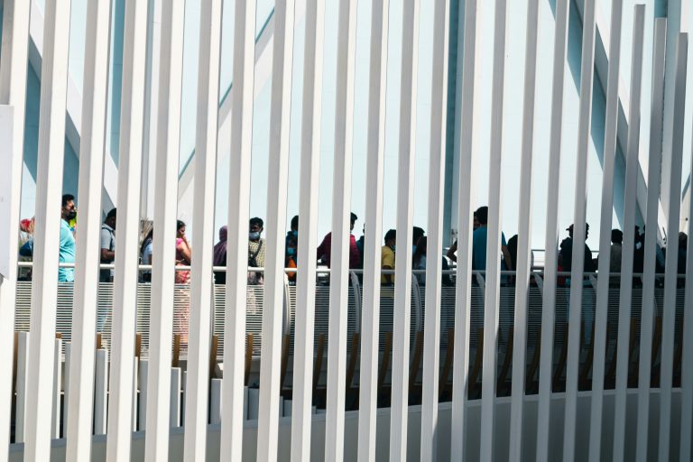 Can TPS Holders Be Deported? Here’s the Truth You Need to Know 1 a group of people standing on a railing