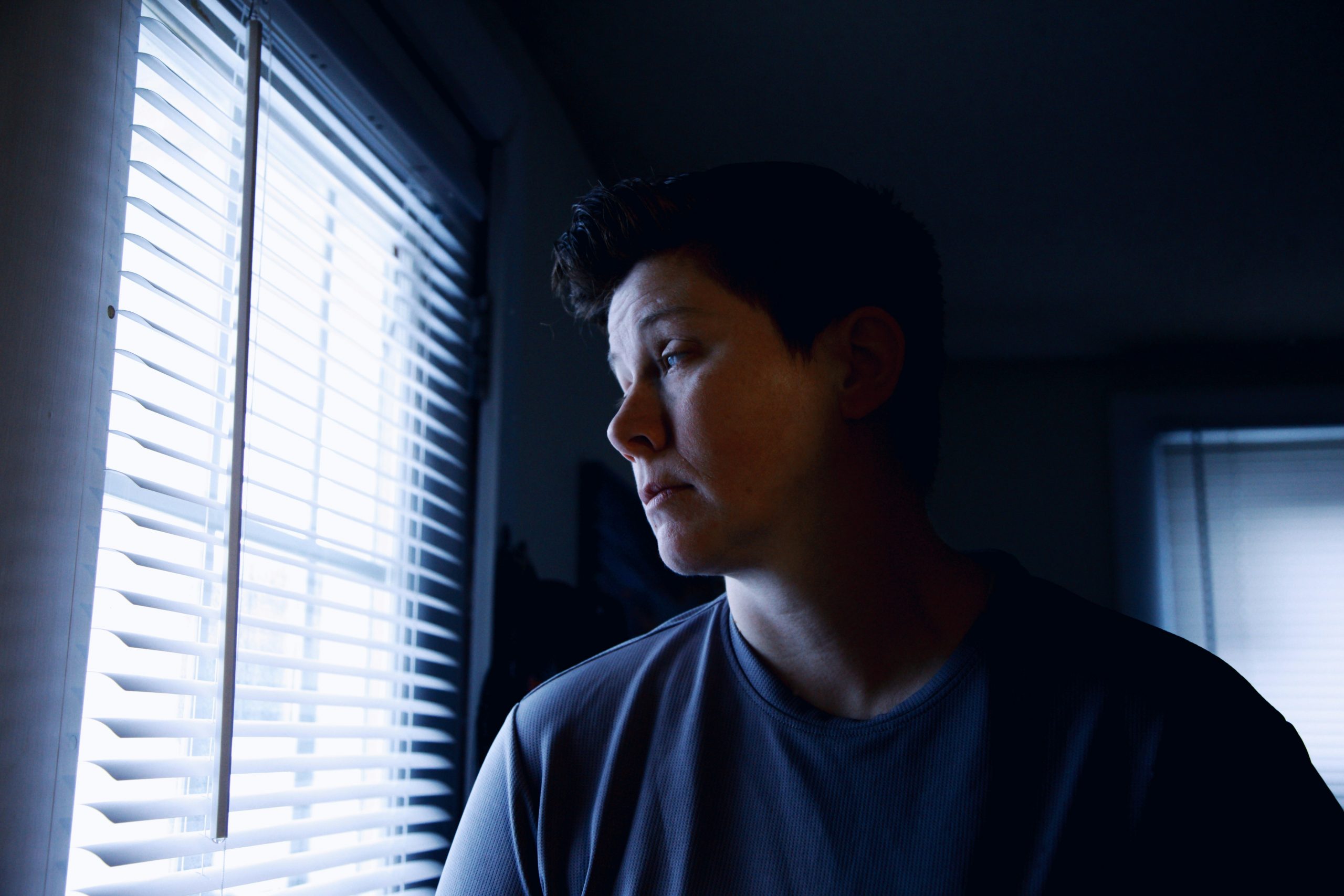 a woman looking out a window